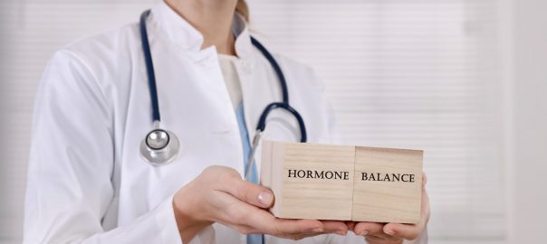 Doctor illustrating balanced hormone health.